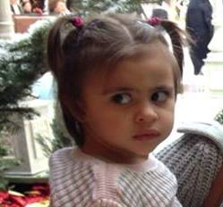 The beginning of a scowl. You may wonder if she wants to cut you.....